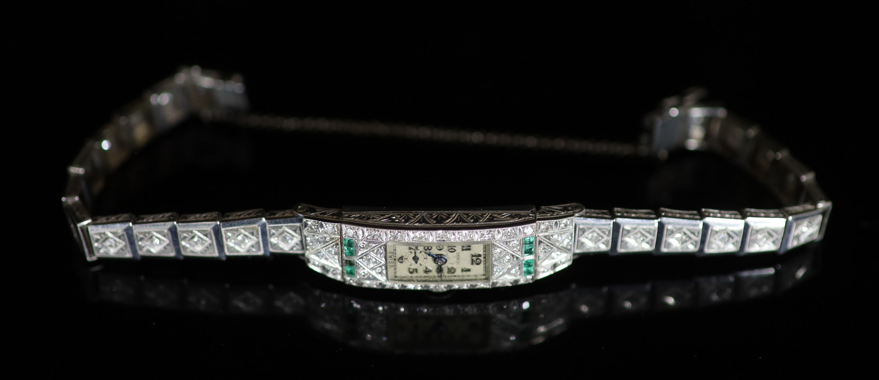 A lady's 1920's/1930's platinum, emerald and diamond set manual wind Everest cocktail watch